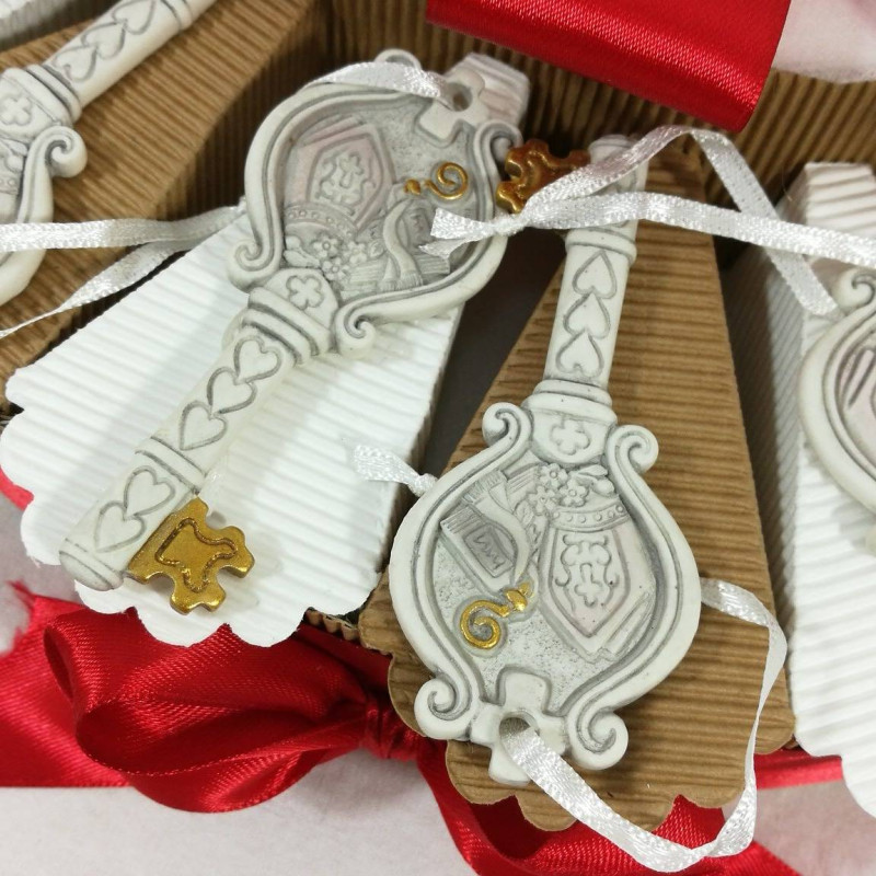 BOMBONIERE PER CRESIMA SU TORTA CHIAVE SACRA