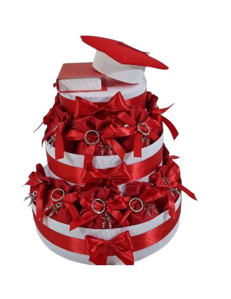 Torta bomboniere laurea con sacchetti rossi portachiavi compasso